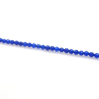 Blue quartz faceted round beads 15 inch - overhead flat lay view