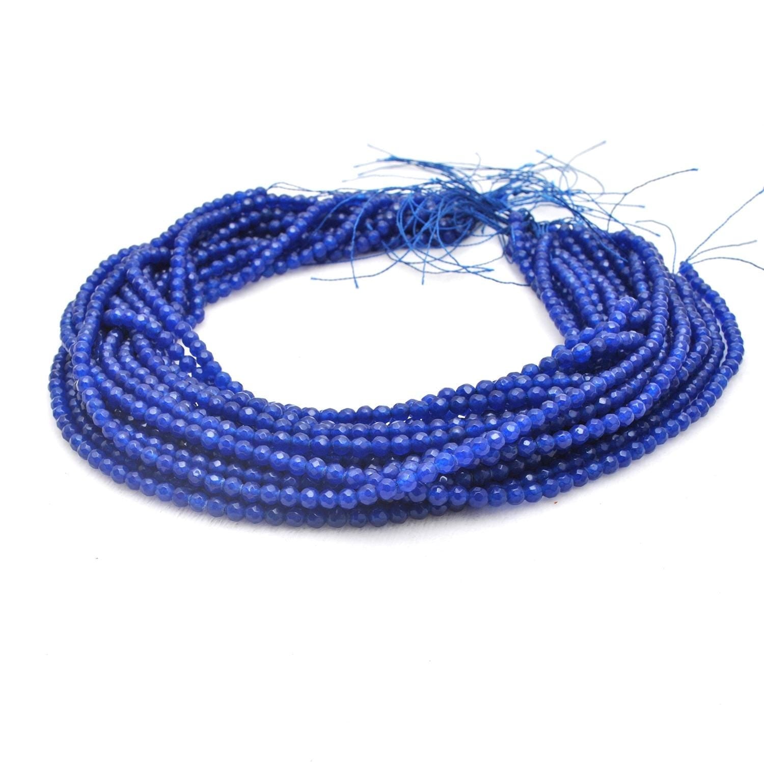 Blue quartz round beads strand - close-up soft blue faceted detail