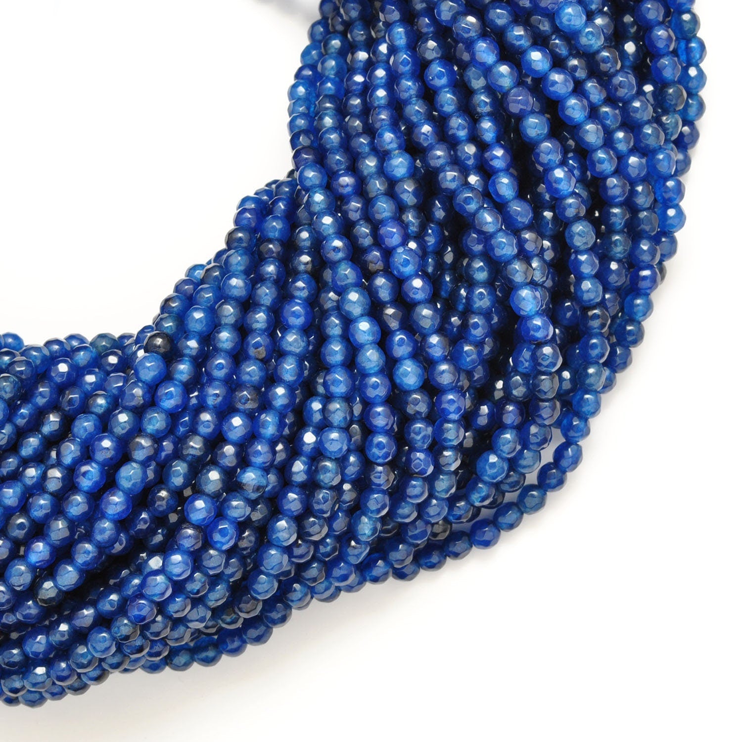 Blue quartz round faceted 15 inch strand - overhead flat lay