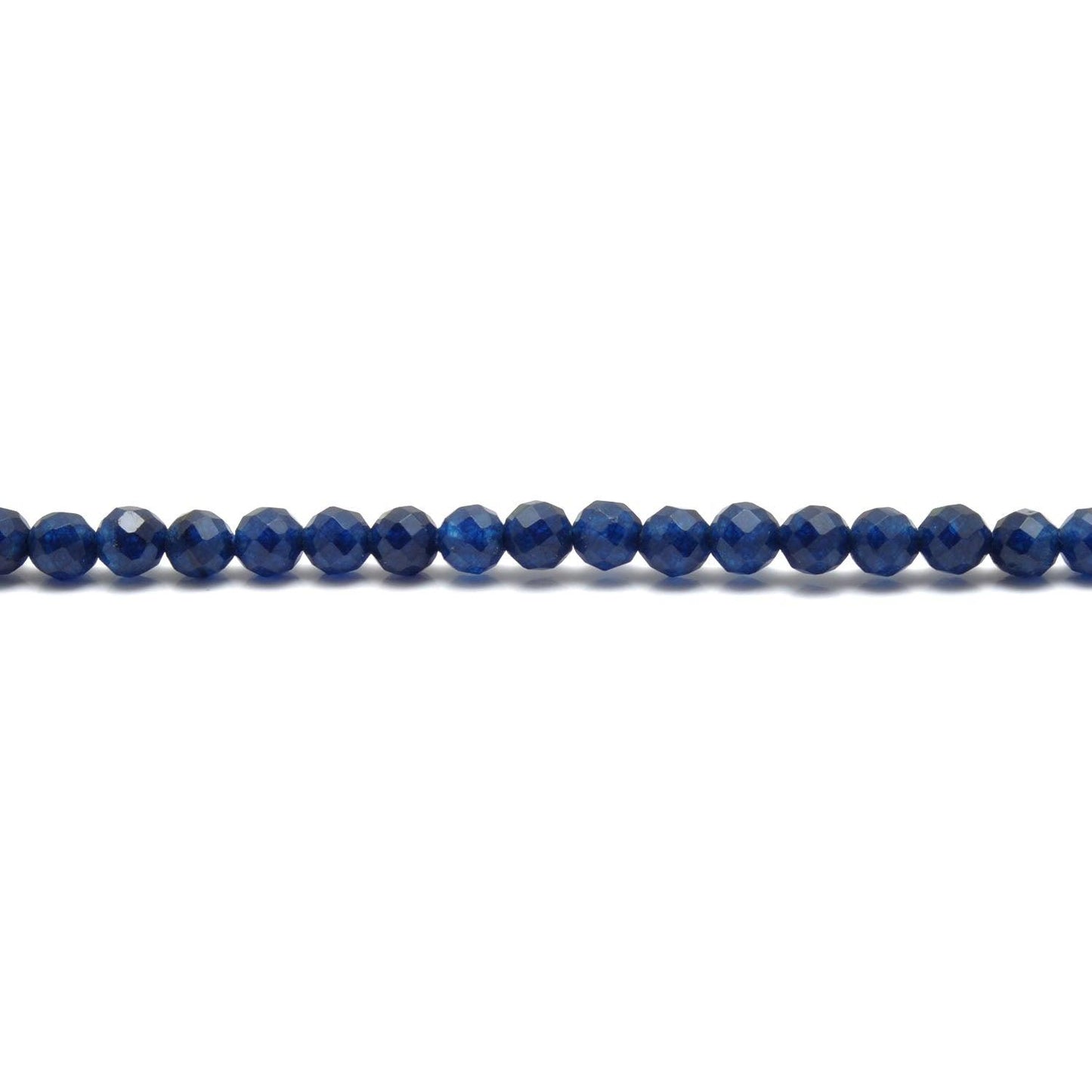 Blue quartz round faceted beads - scattered loose crystal view