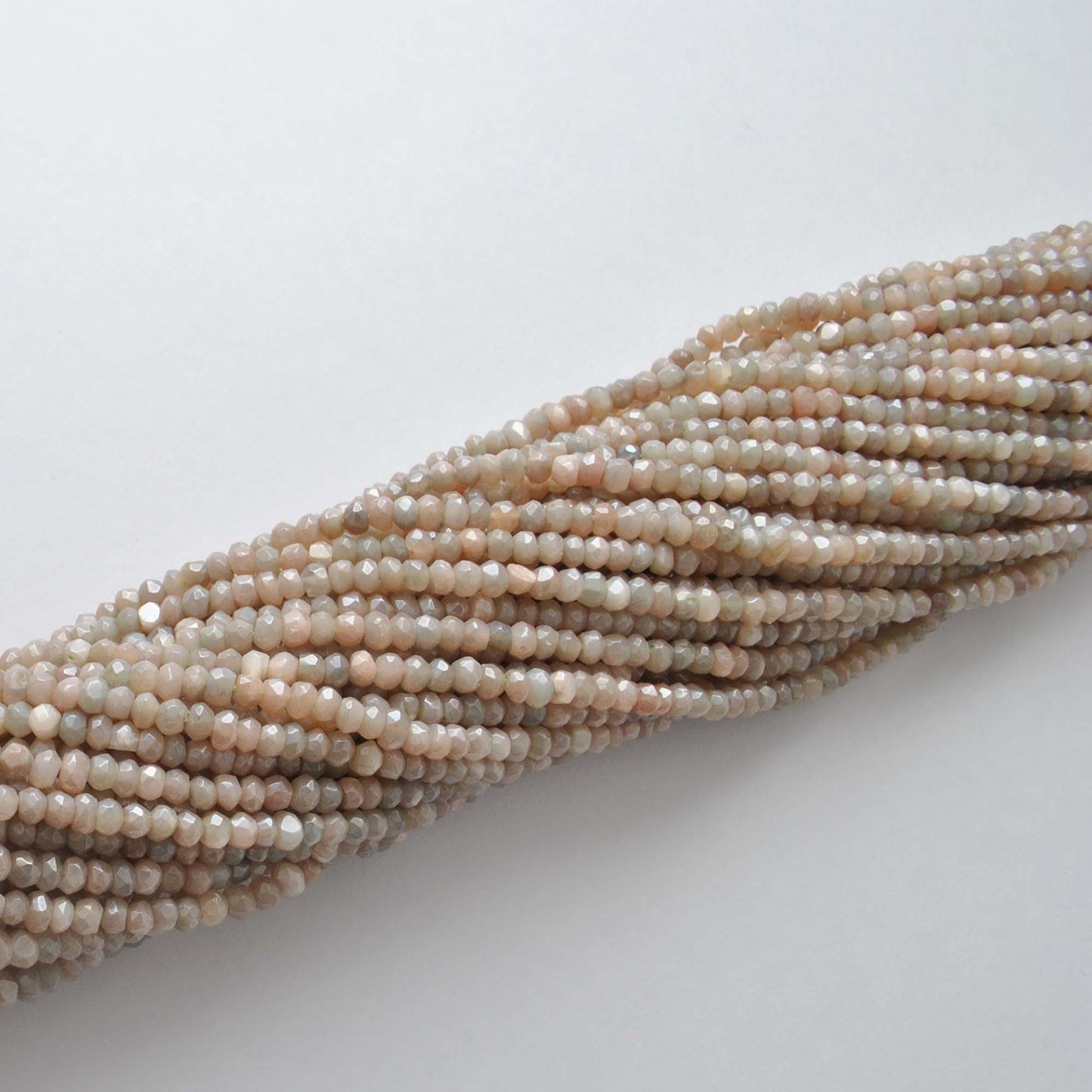 Brown moonstone faceted beads - overhead flat lay warm tones