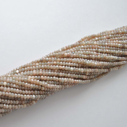 Brown moonstone faceted beads - overhead flat lay warm tones
