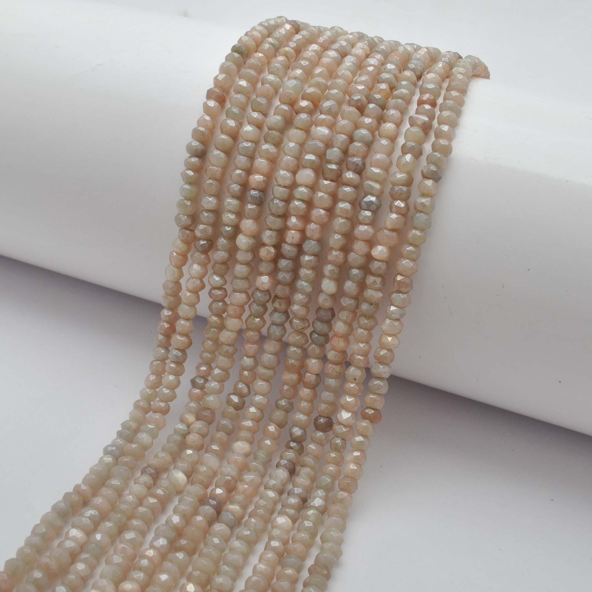 Brown moonstone rondelle beads for jewelry making - scale reference