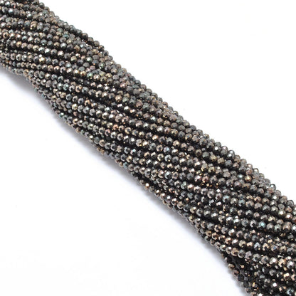 Brown pyrite faceted beads - side profile scattered loose