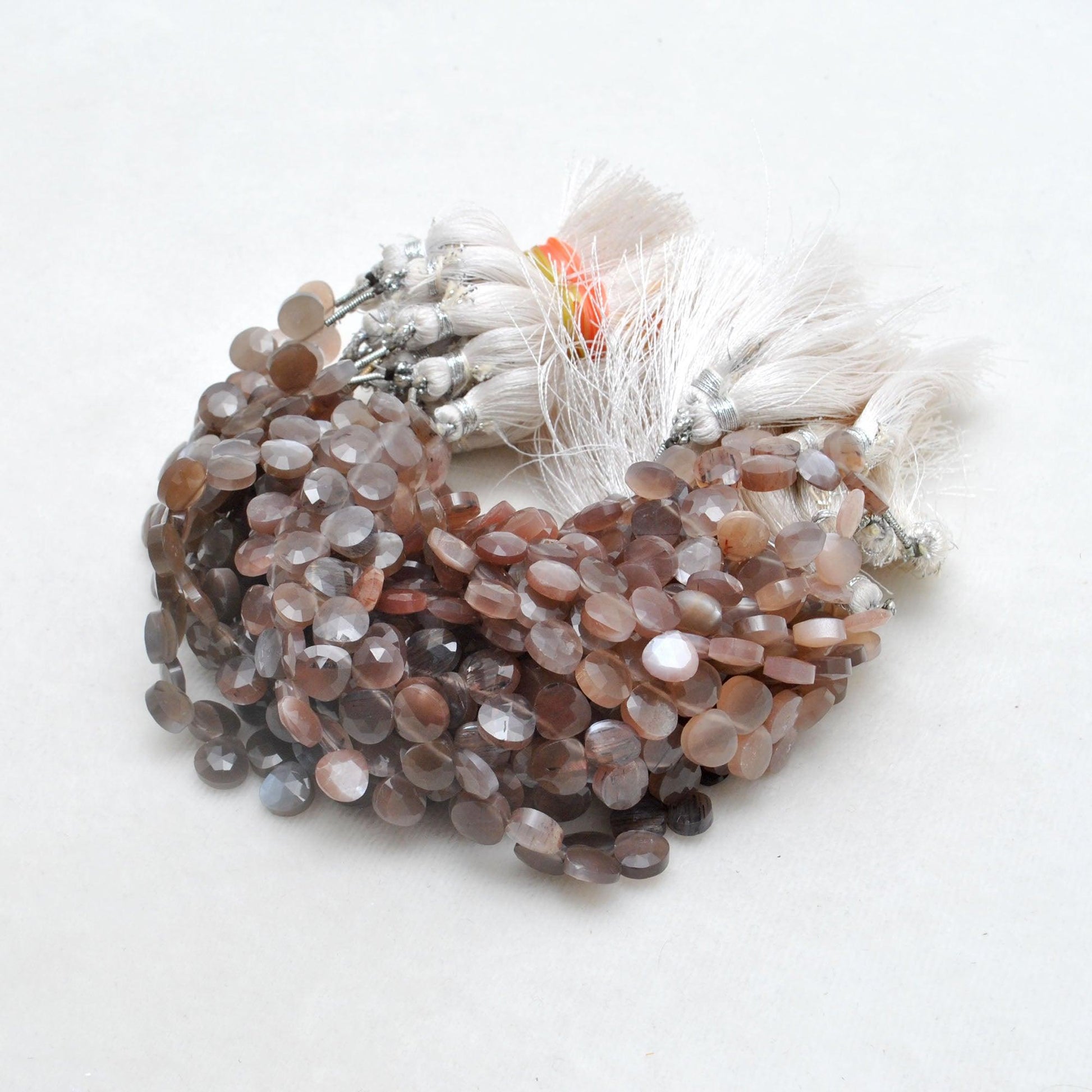 Chocolate moonstone heart beads - adularescence glow angle view