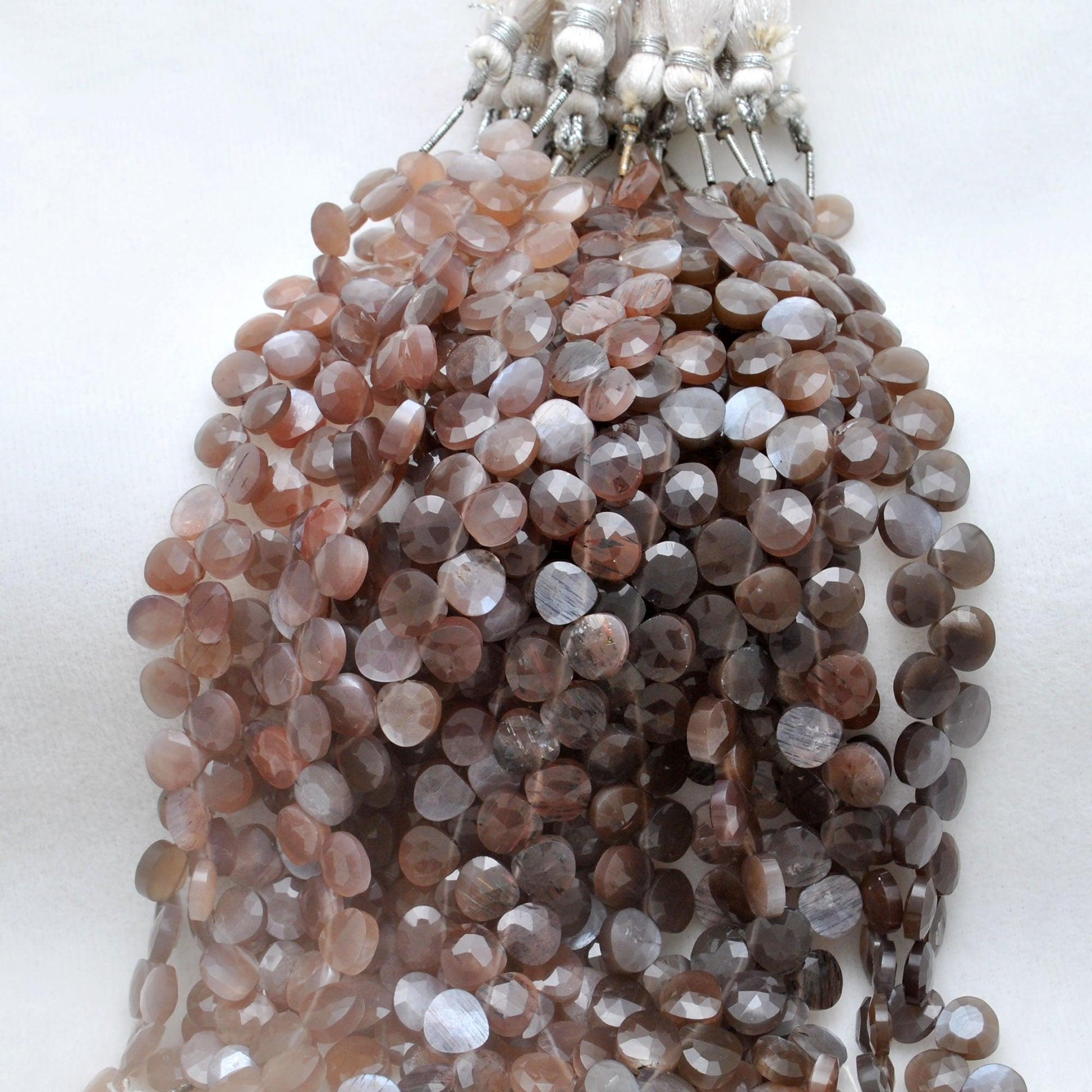 Chocolate moonstone heart beads - close-up caramel inner glow