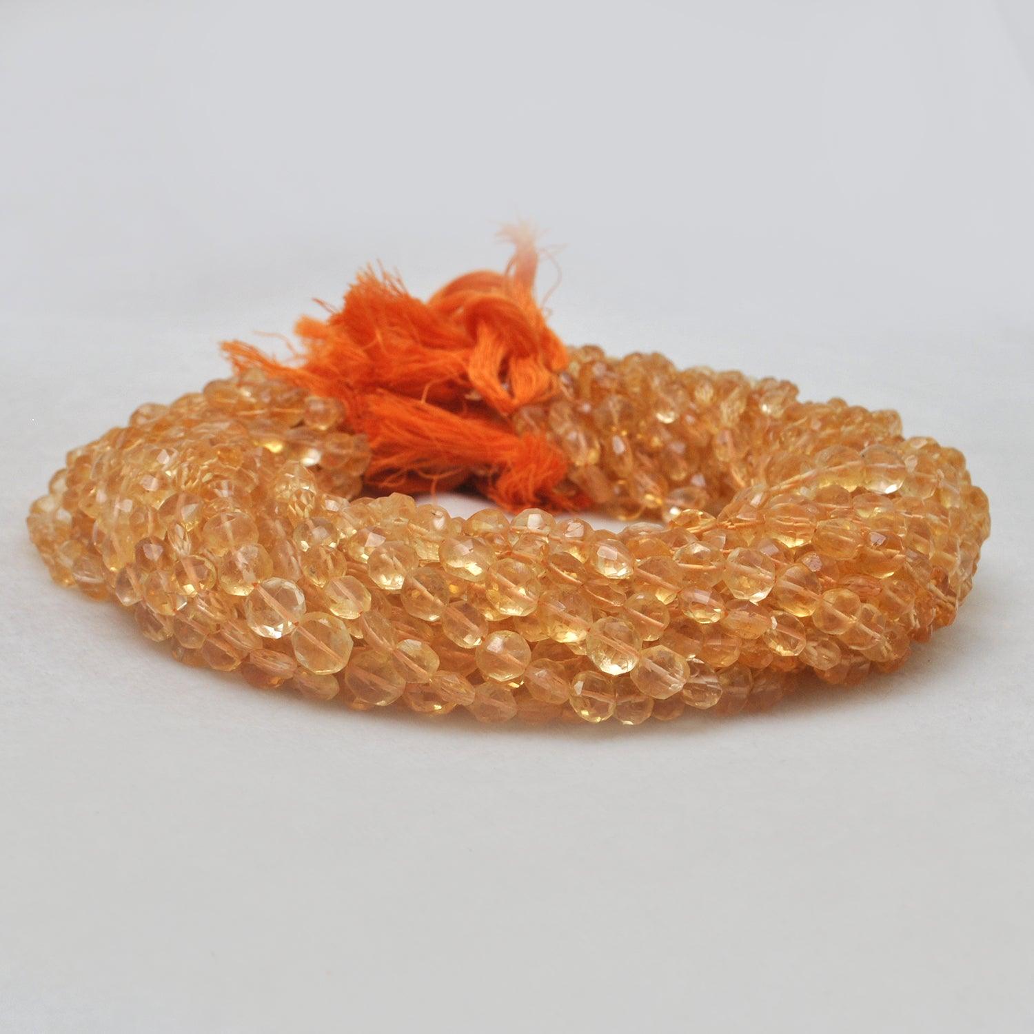 Citrine coin beads faceted - close-up golden yellow disc detail