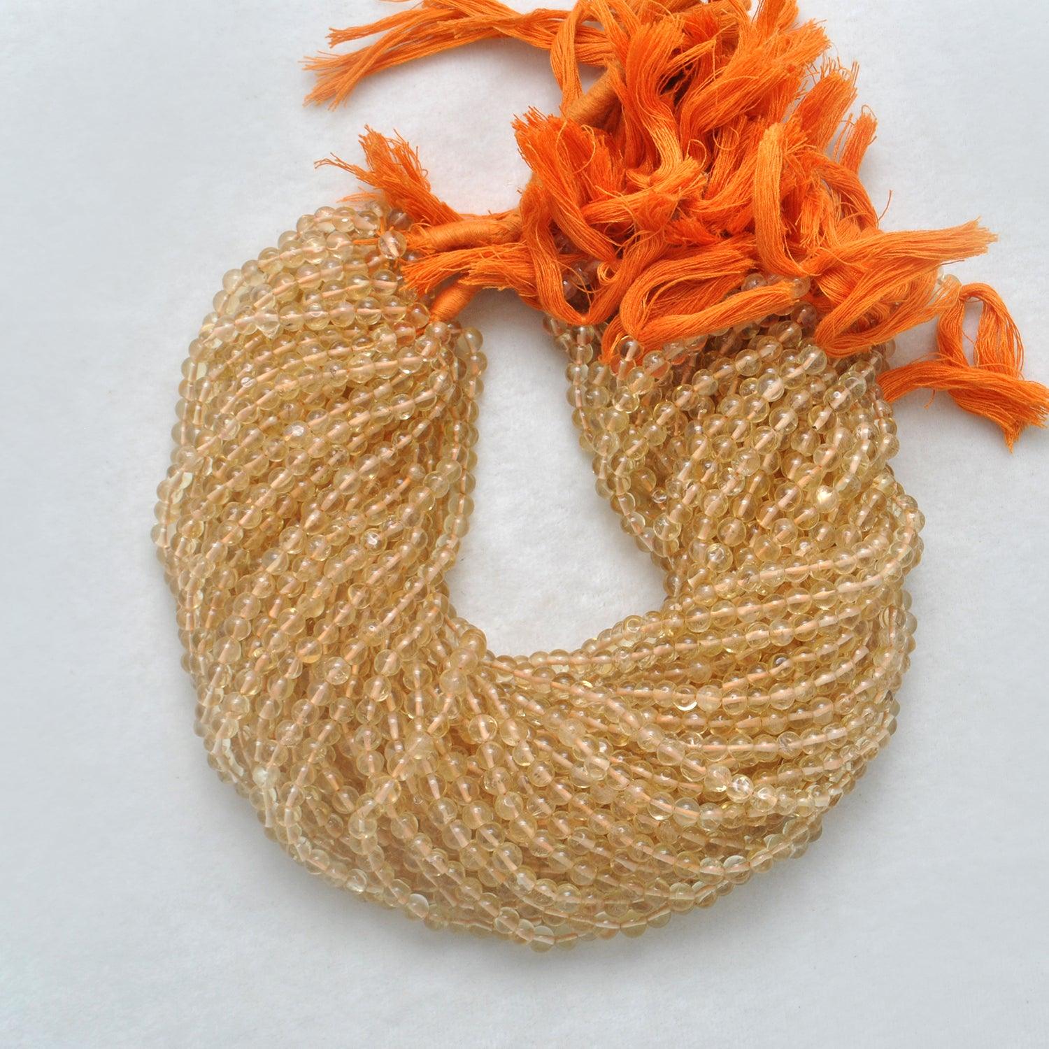 Citrine plain round beads - close-up smooth warm golden yellow