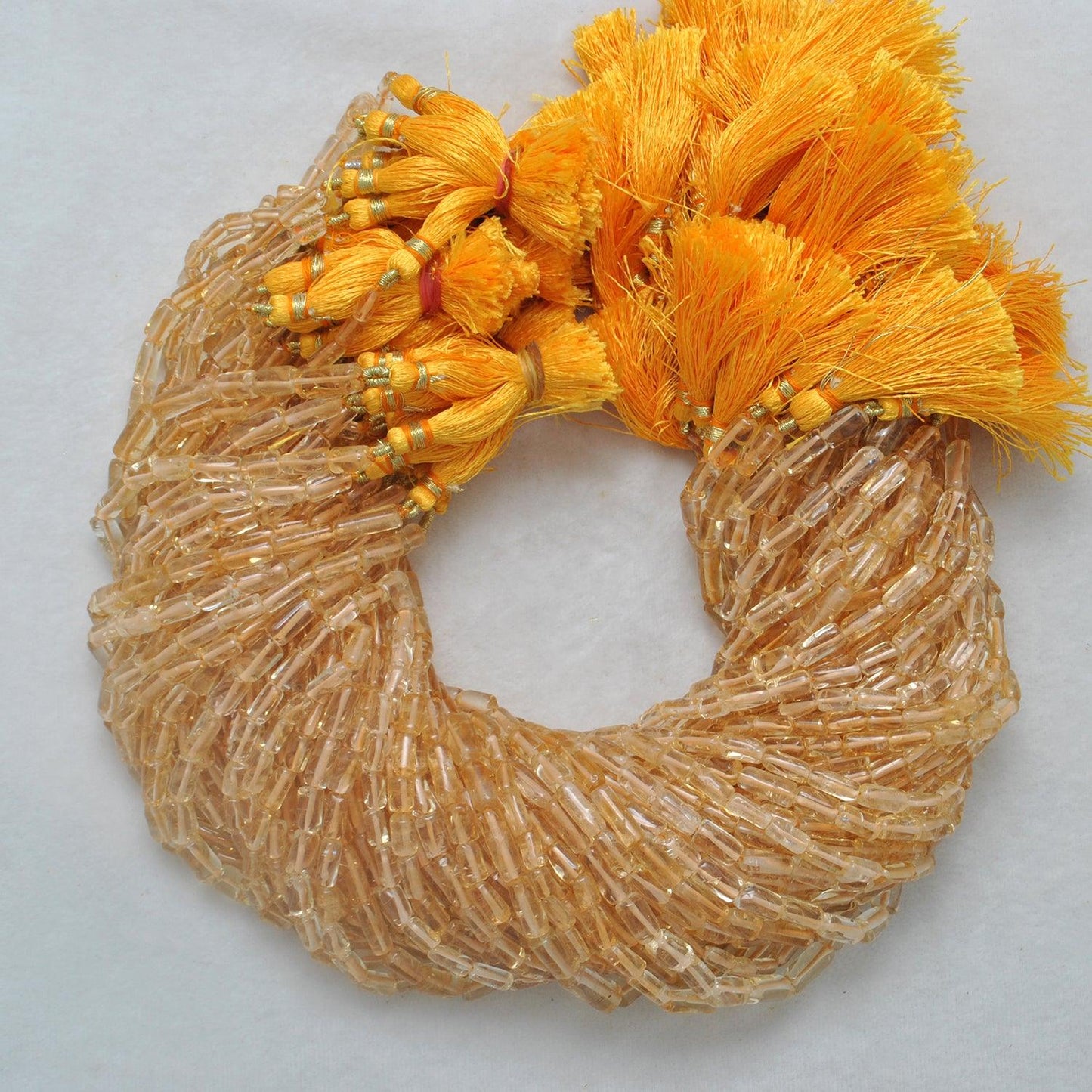 Citrine tube beads - close-up elongated golden tube shape