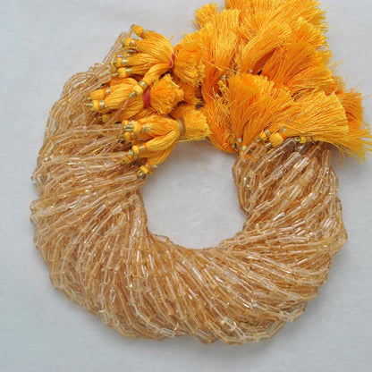 Citrine tube beads - close-up elongated golden tube shape