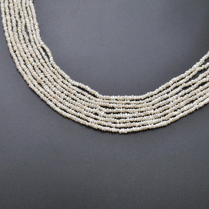 Freshwater pearl rondelle 2mm beads - close-up lustre detail