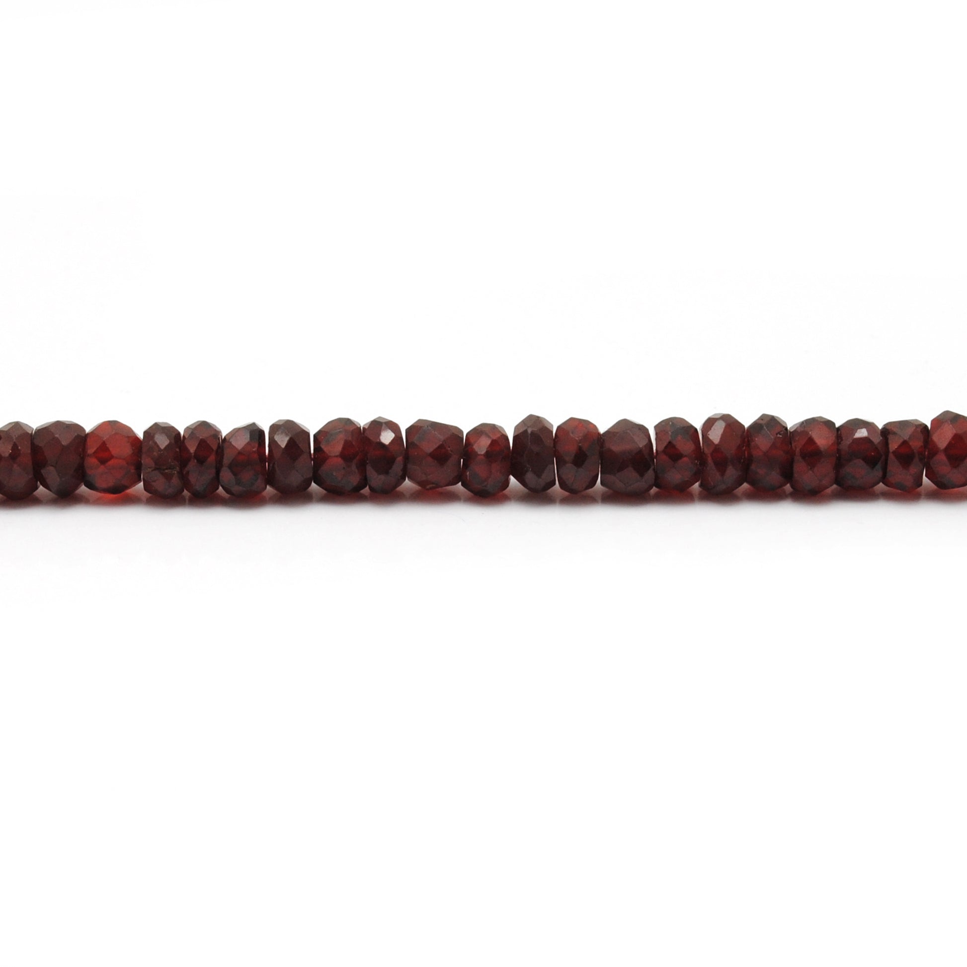 Garnet faceted rondelle beads scattered loose - deep red range