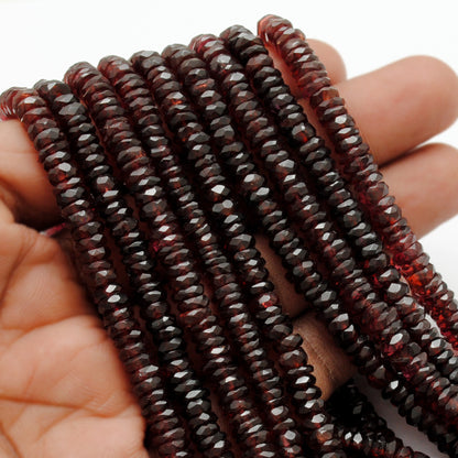 Garnet tyre beads scattered loose - deep red range view