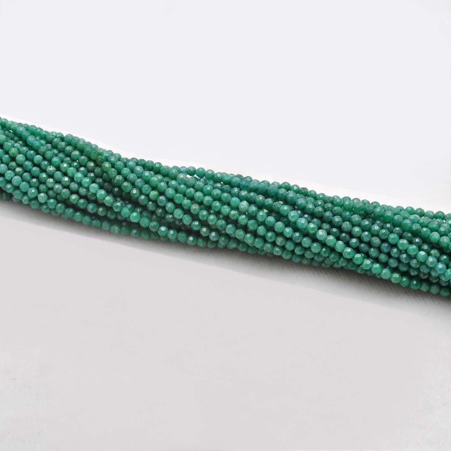 Green moonstone healing crystal beads - scattered loose view