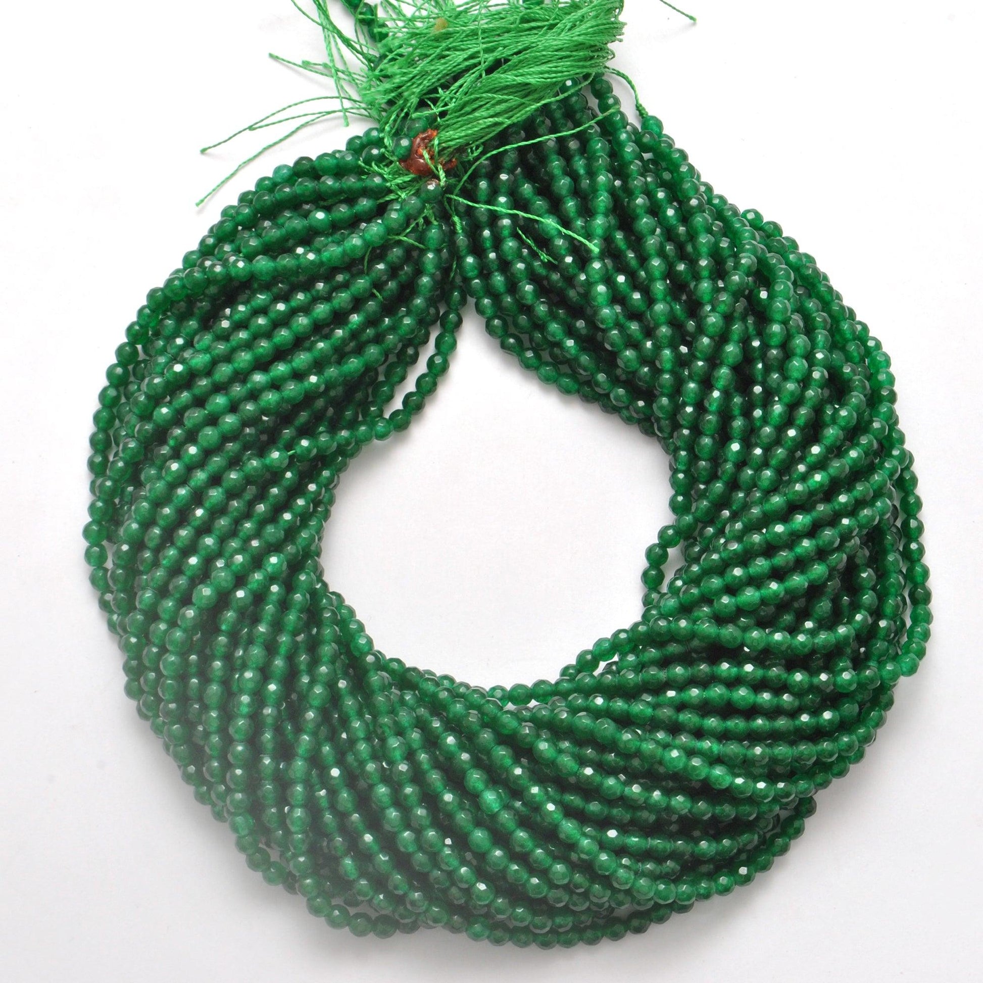 Green quartz 4mm faceted beads strand 15 inch - overhead flat lay
