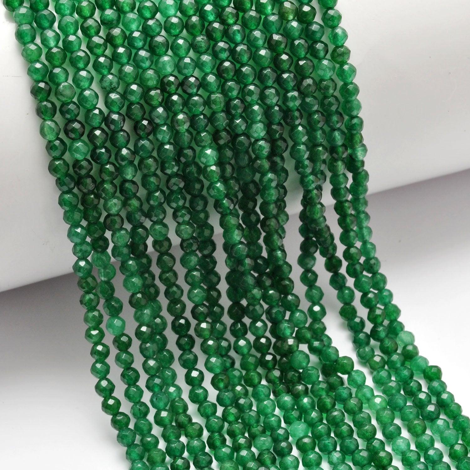 Green quartz round beads - close-up vivid green faceted detail