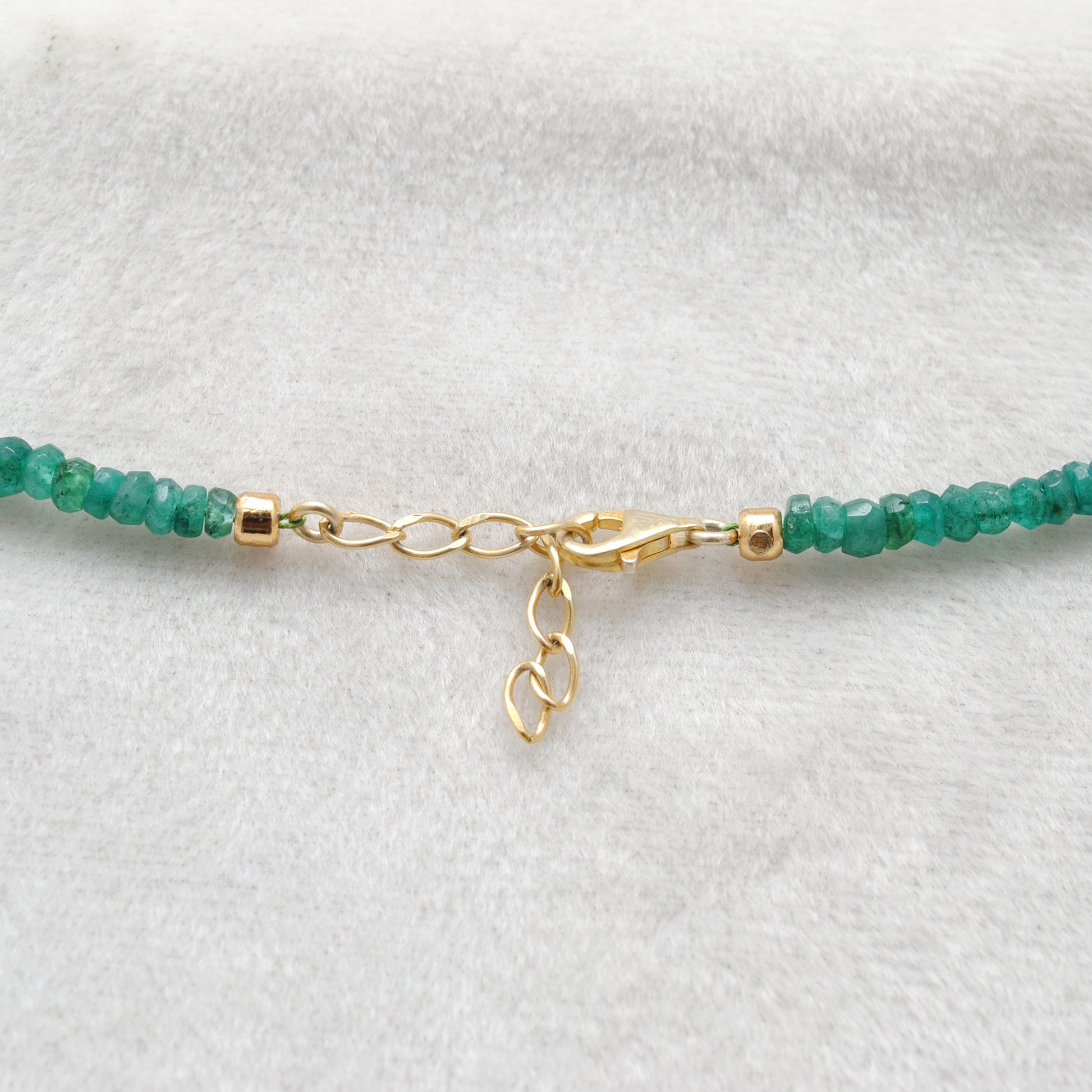 Handmade Faceted Emerald Gold Necklace - Flat Lay Overhead View