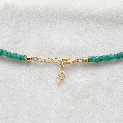 Handmade Faceted Emerald Gold Necklace - Flat Lay Overhead View