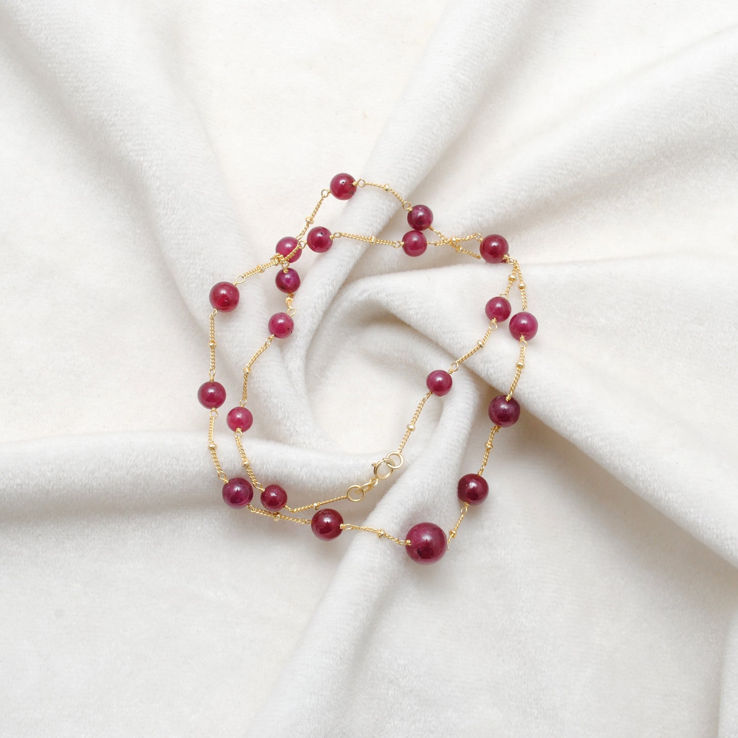 Handmade Ruby Ball Bead Gold Necklace - Flat Lay Lifestyle View