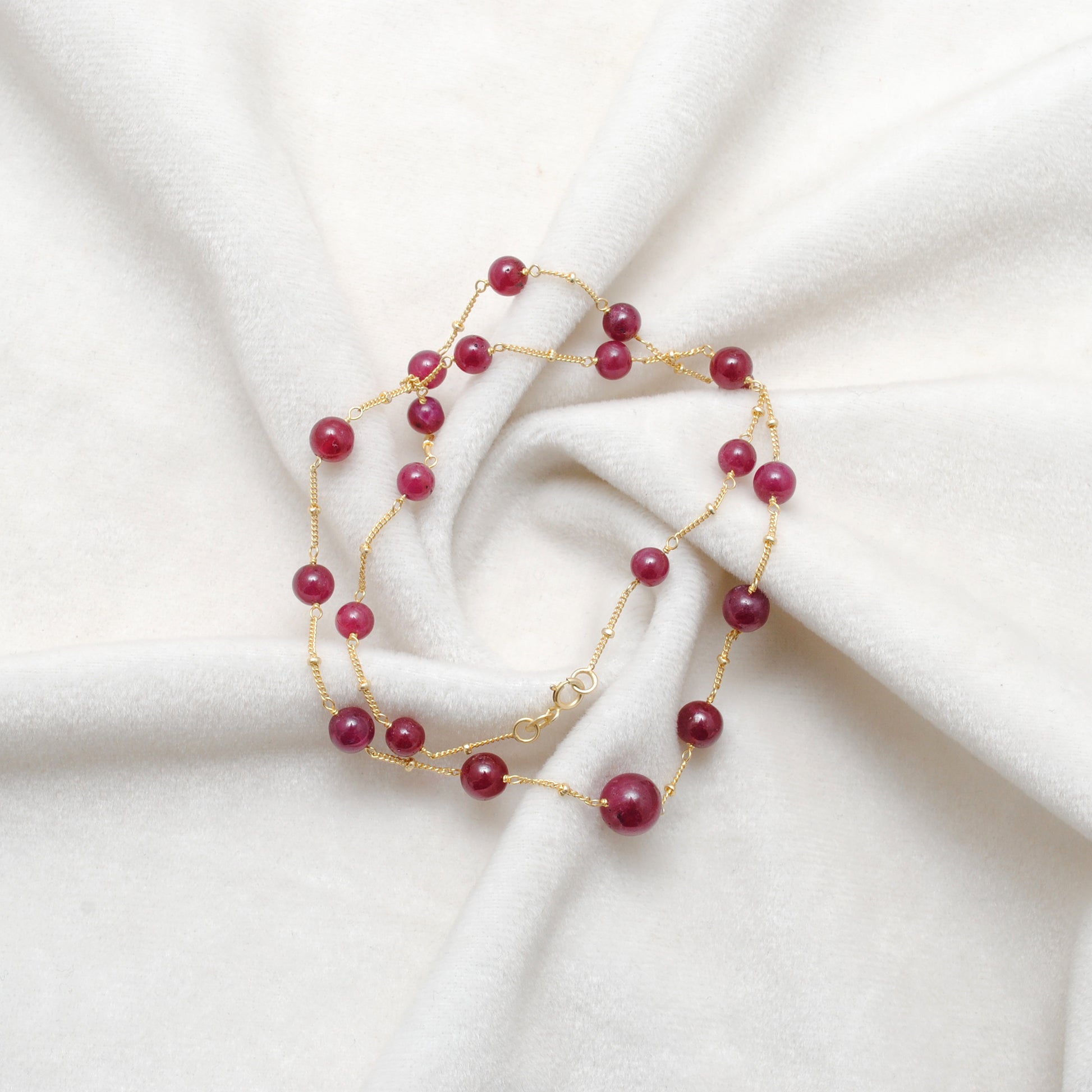 Handmade Ruby Ball Bead Gold Necklace - Flat Lay Lifestyle View