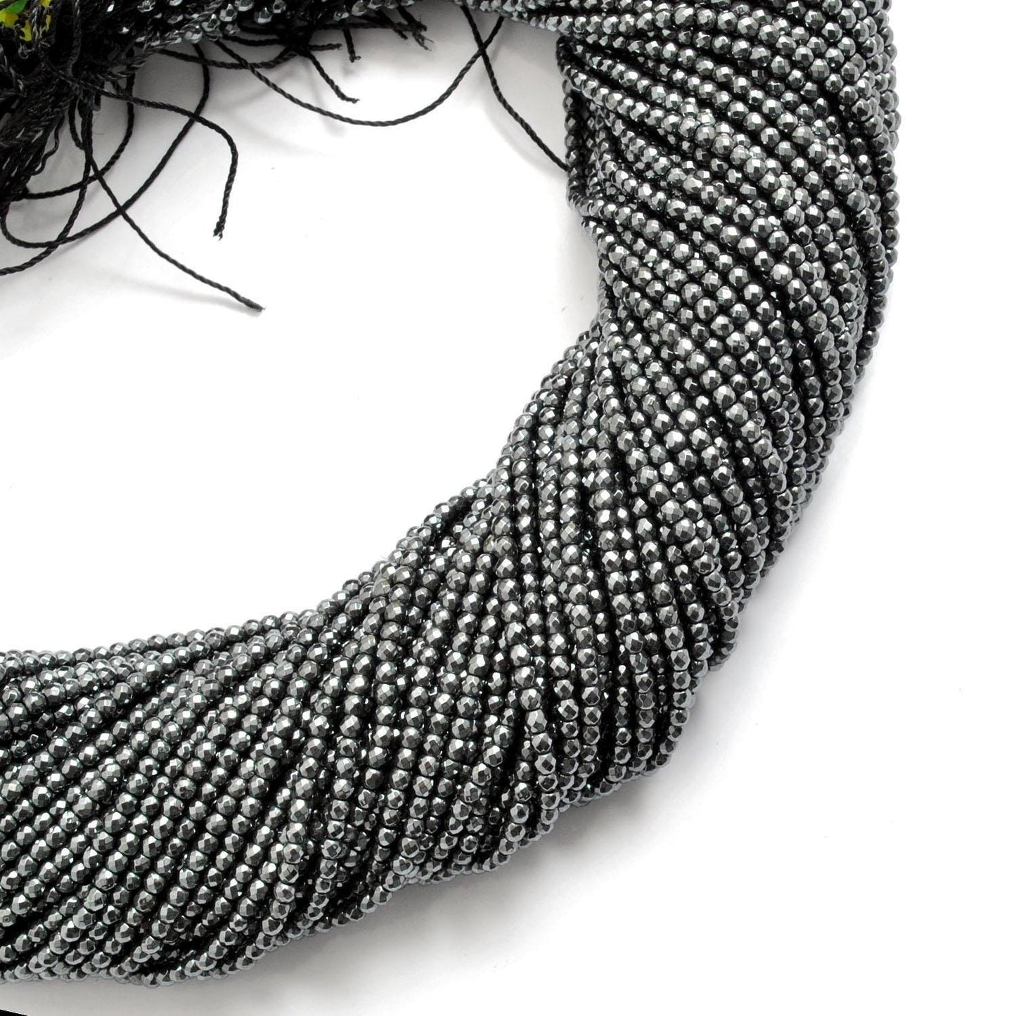 Hematite round beads strand - overhead flat lay dark metallic