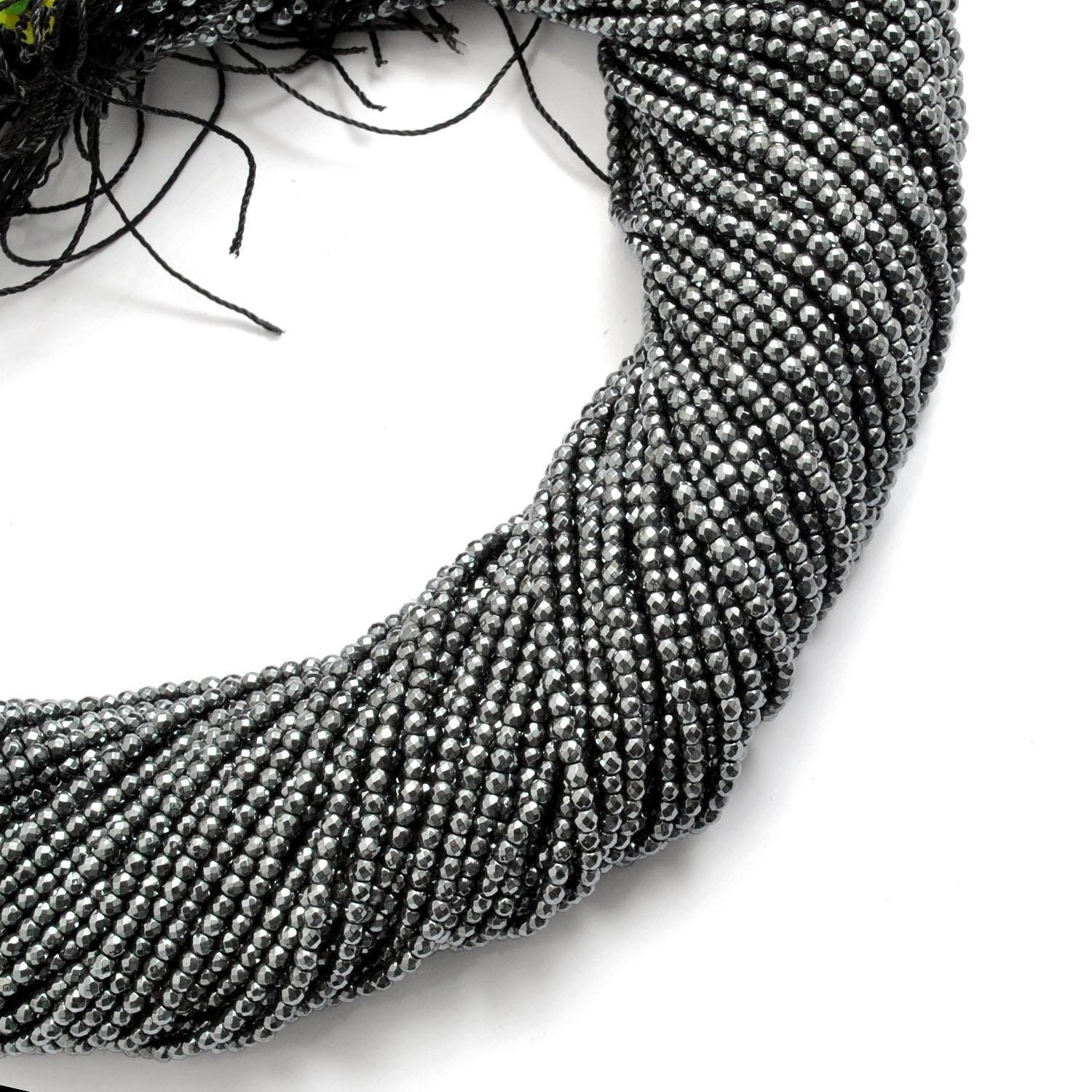 Hematite round beads strand - overhead flat lay dark metallic