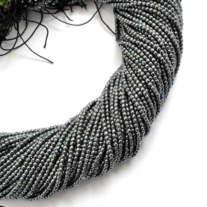 Hematite round beads strand - overhead flat lay dark metallic