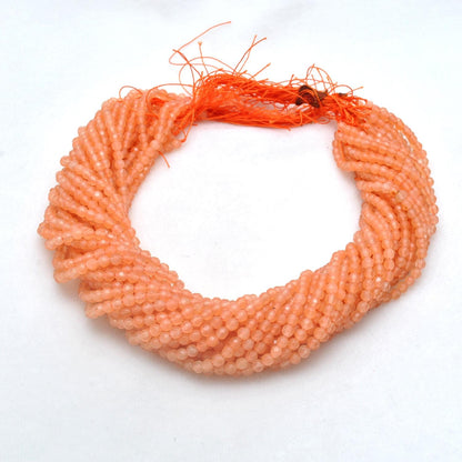 Honey quartz 4mm round beads - close-up warm amber golden tone