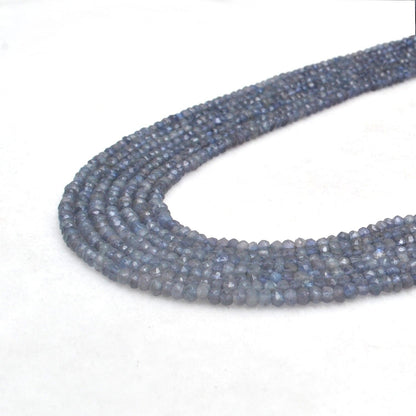 Iolite rondelle beads - close-up pleochroic violet-blue color