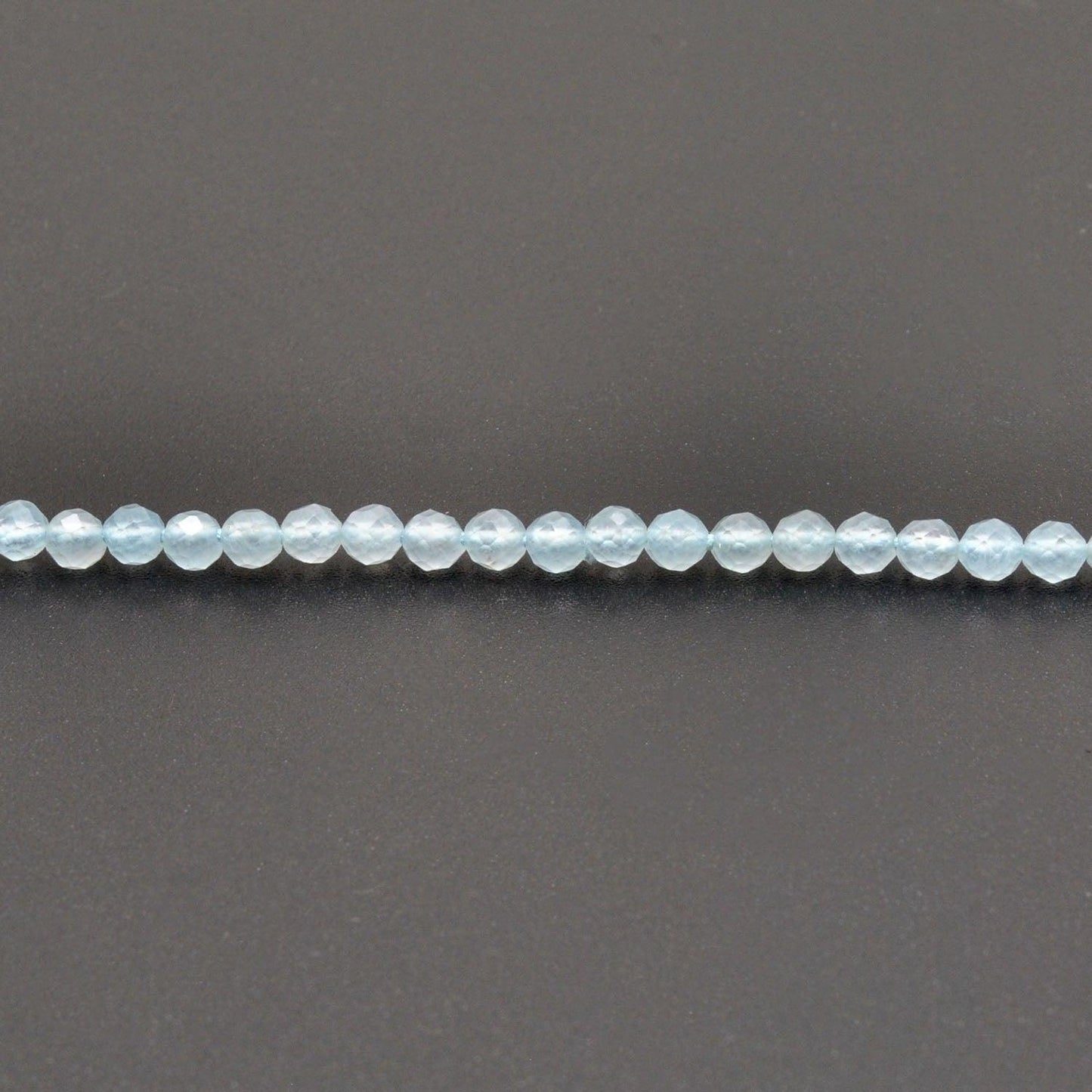 Light blue quartz beads for delicate jewelry - scale reference