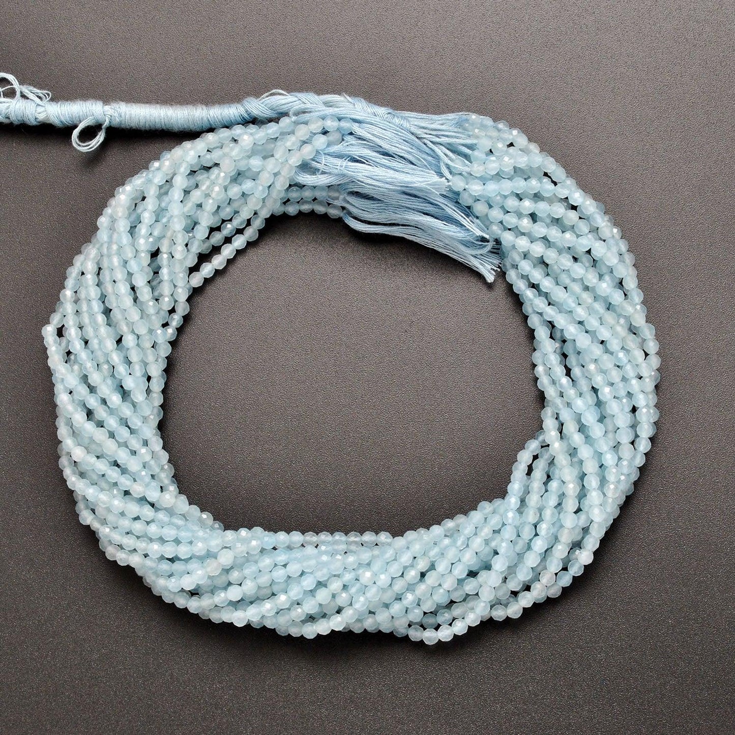 Light blue quartz round beads - close-up pale sky blue faceted