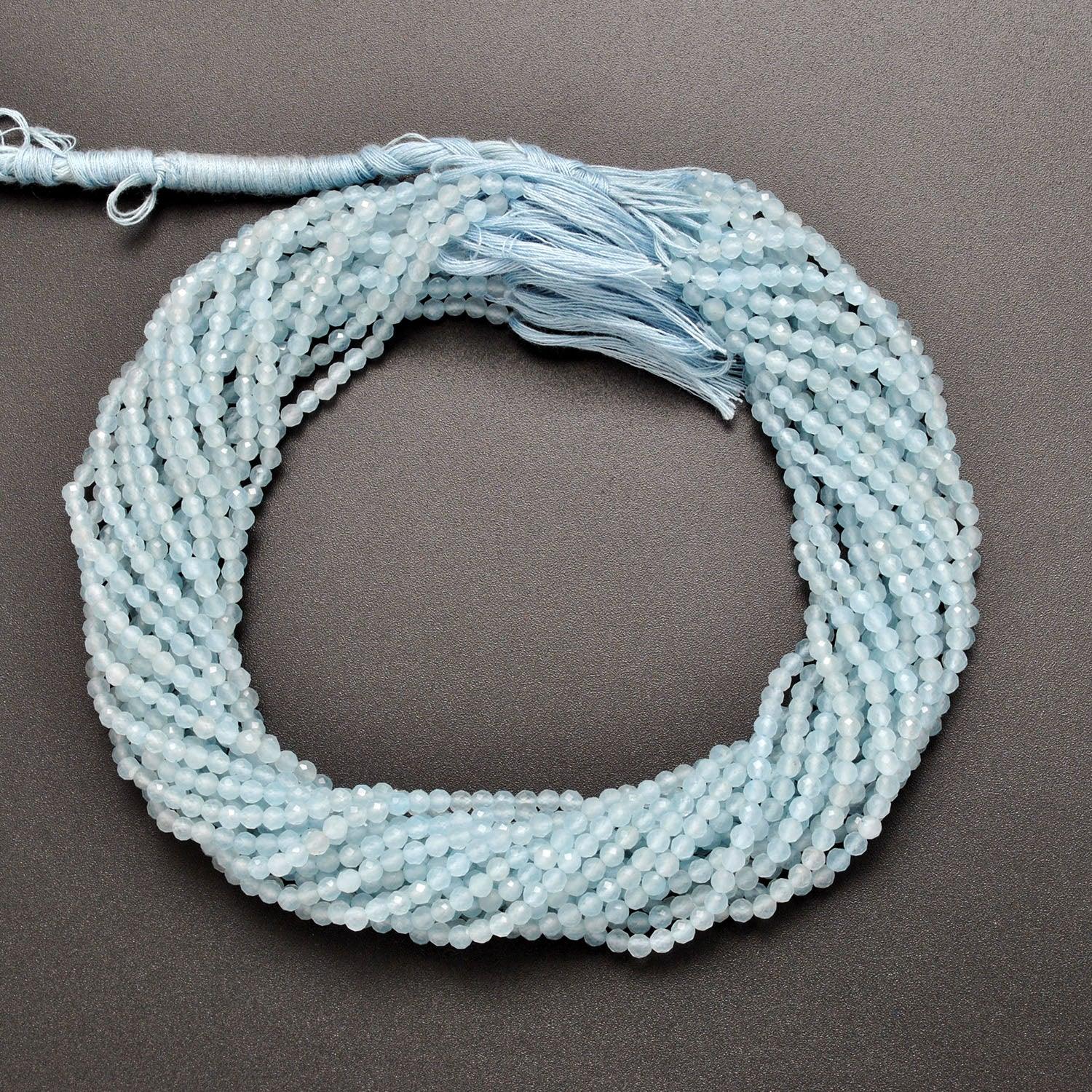 Light blue quartz round beads - close-up pale sky blue faceted