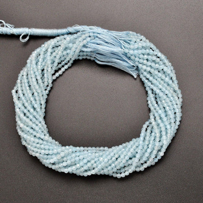 Light blue quartz round beads - close-up pale sky blue faceted