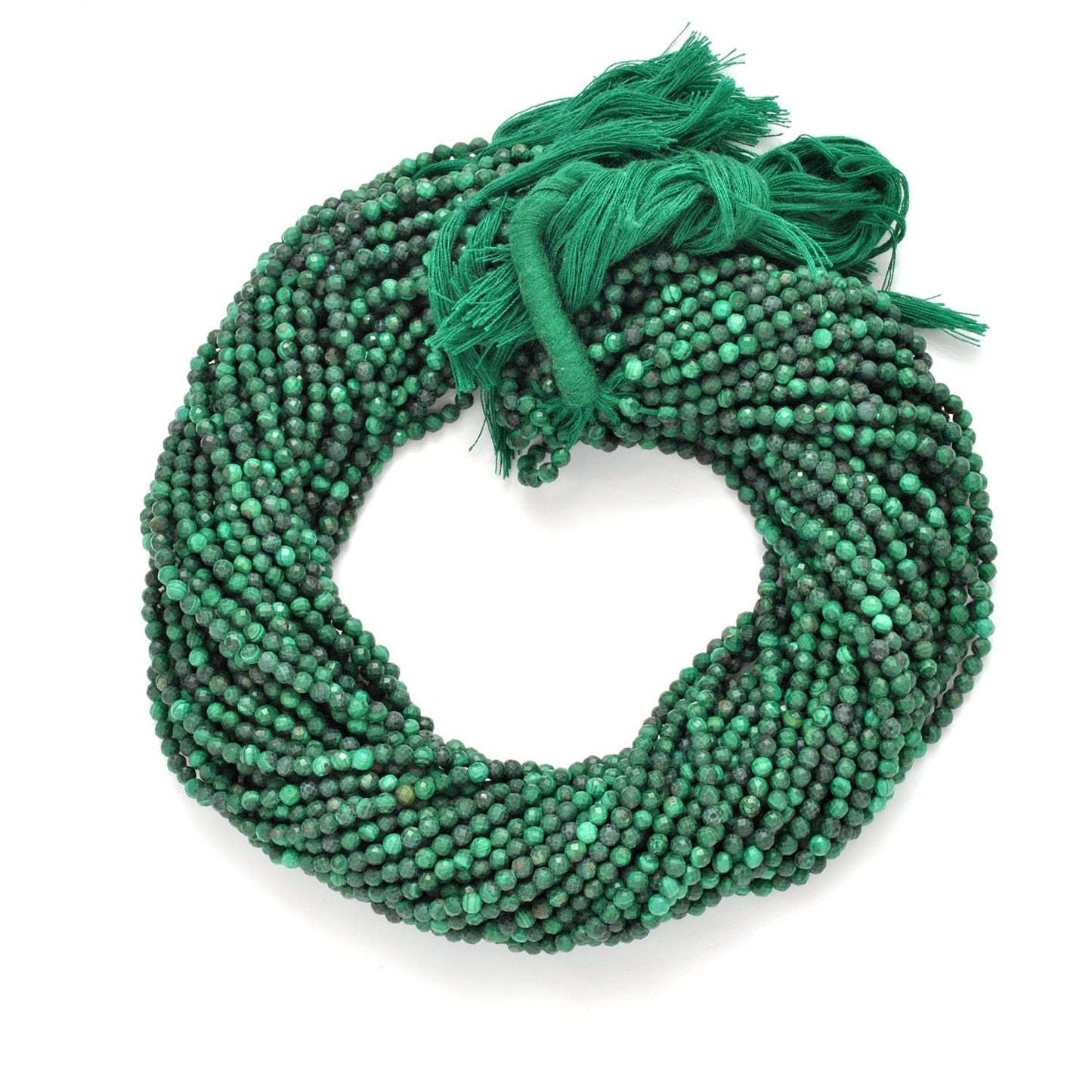 Malachite round faceted beads - close-up concentric green banding
