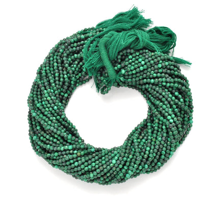 Malachite round faceted beads - close-up concentric green banding