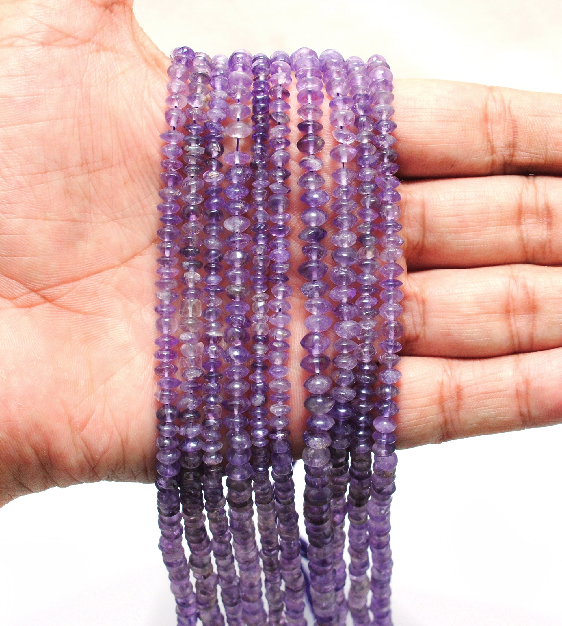 Natural amethyst button beads strand 15 inch - overhead flat lay