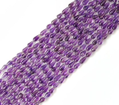 Natural amethyst drop beads 5x8mm strand - overhead flat lay