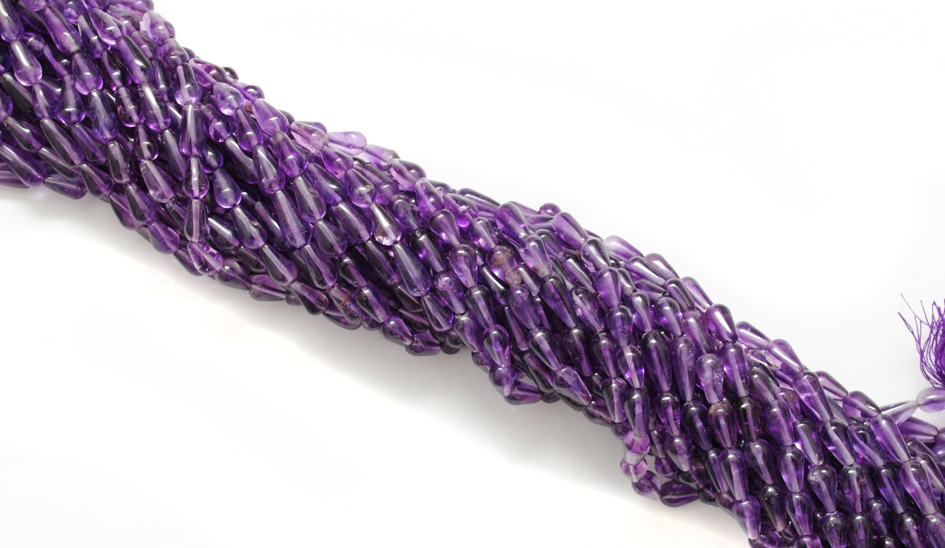 Natural amethyst drop beads 6x11mm - scale reference pendant