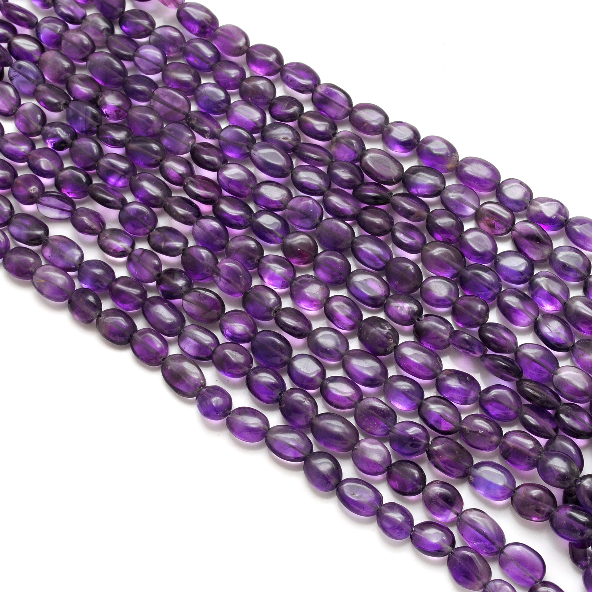 Natural amethyst oval beads 14 inch strand - overhead flat lay