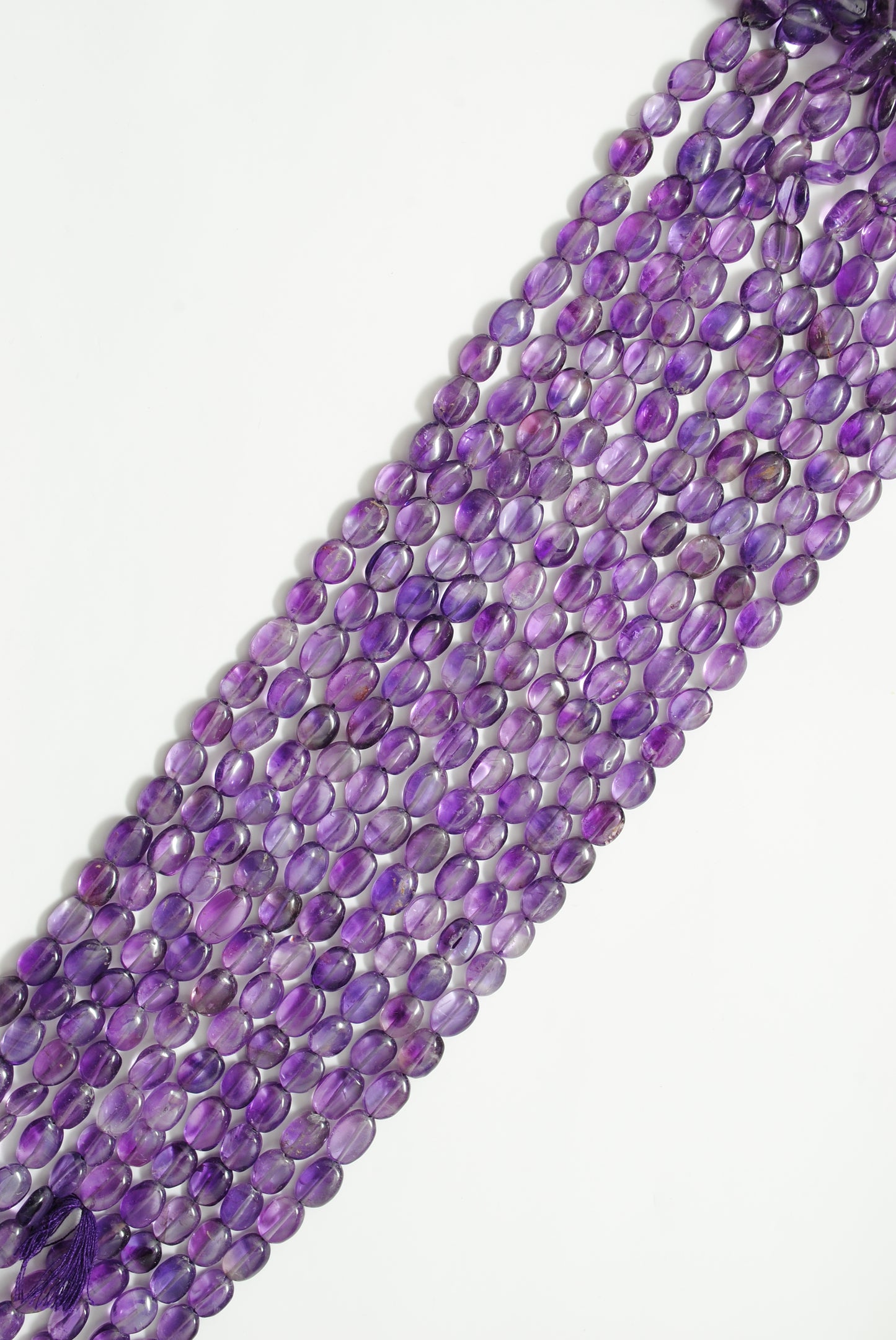 Natural amethyst oval beads 8x11mm - scale reference bold