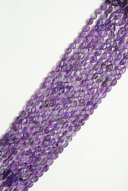 Natural amethyst oval beads 8x11mm - scale reference bold