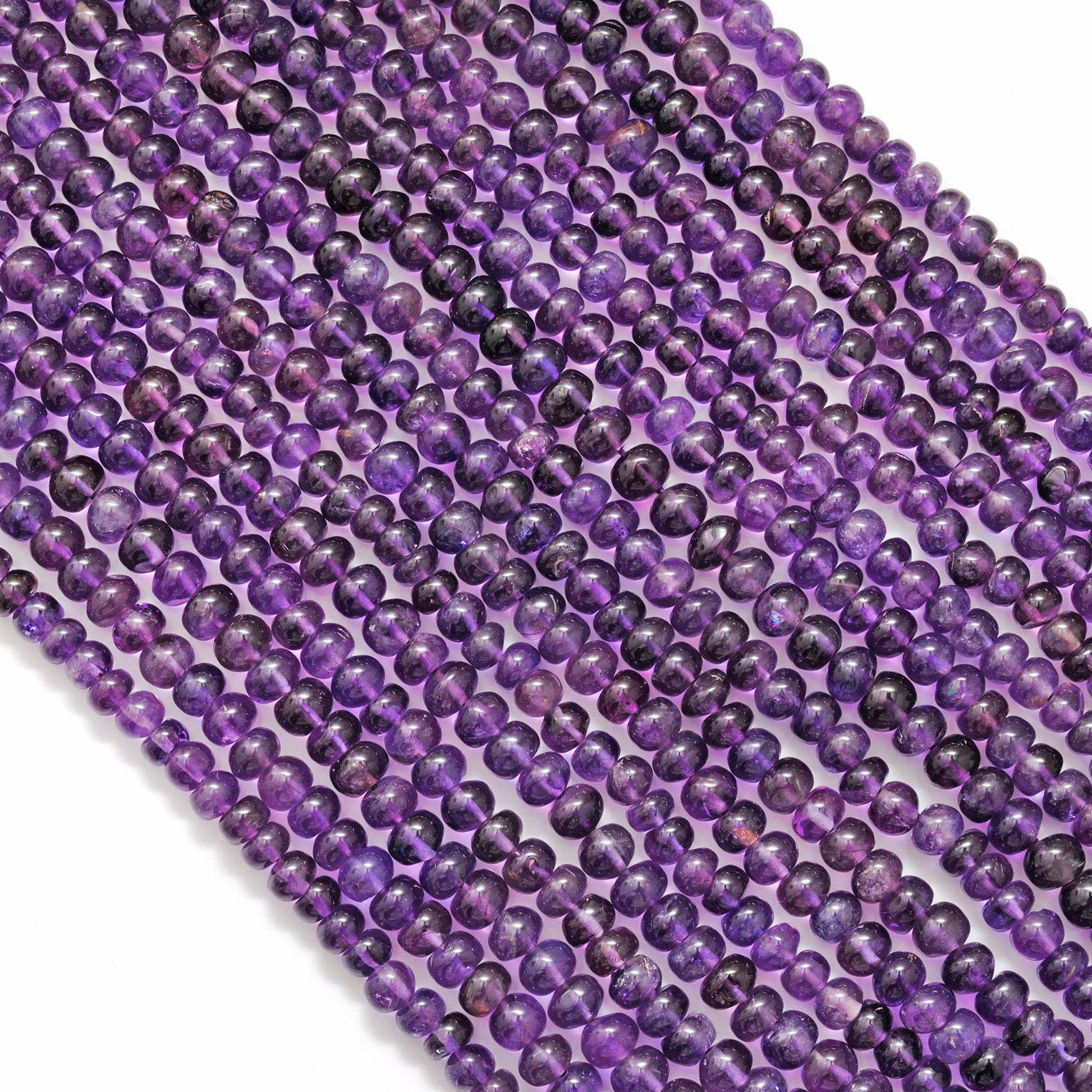 Natural amethyst rondelle beads 15 inch strand - overhead flat lay