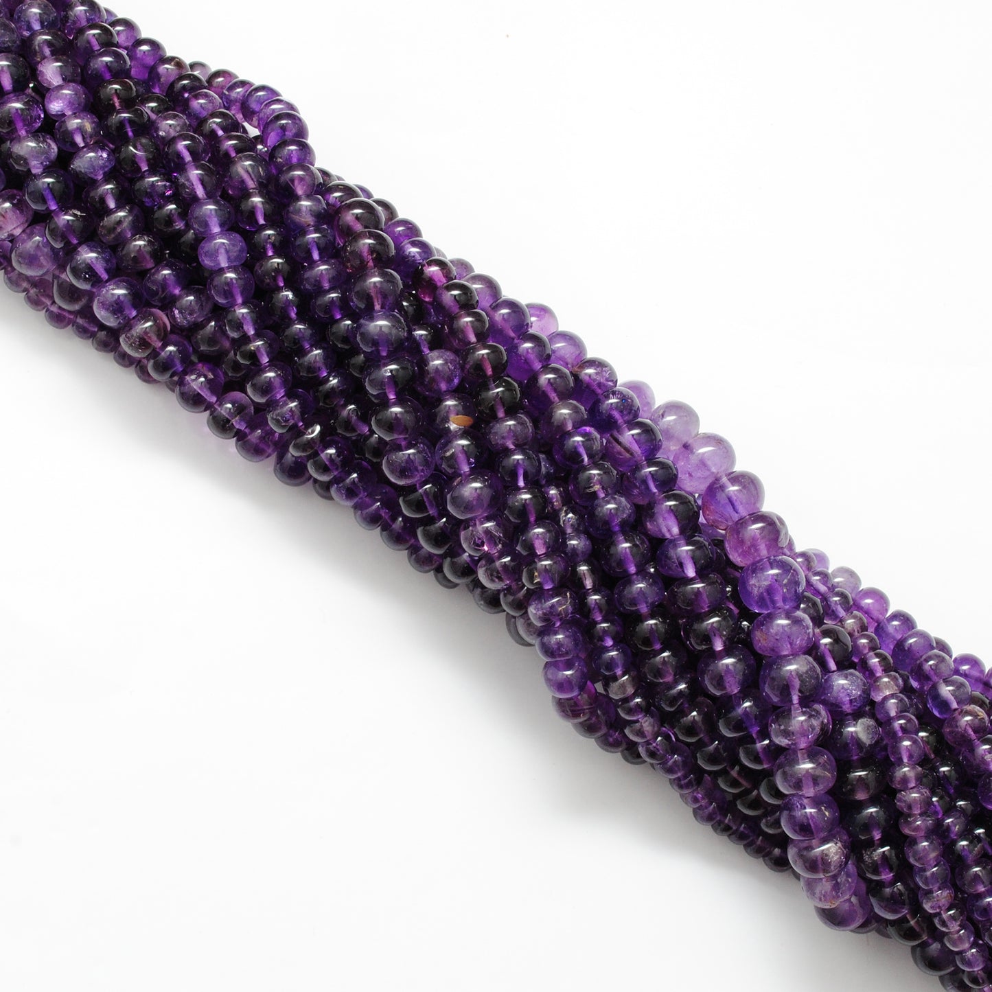 Natural amethyst rondelle beads 15 inch strand - overhead flat lay