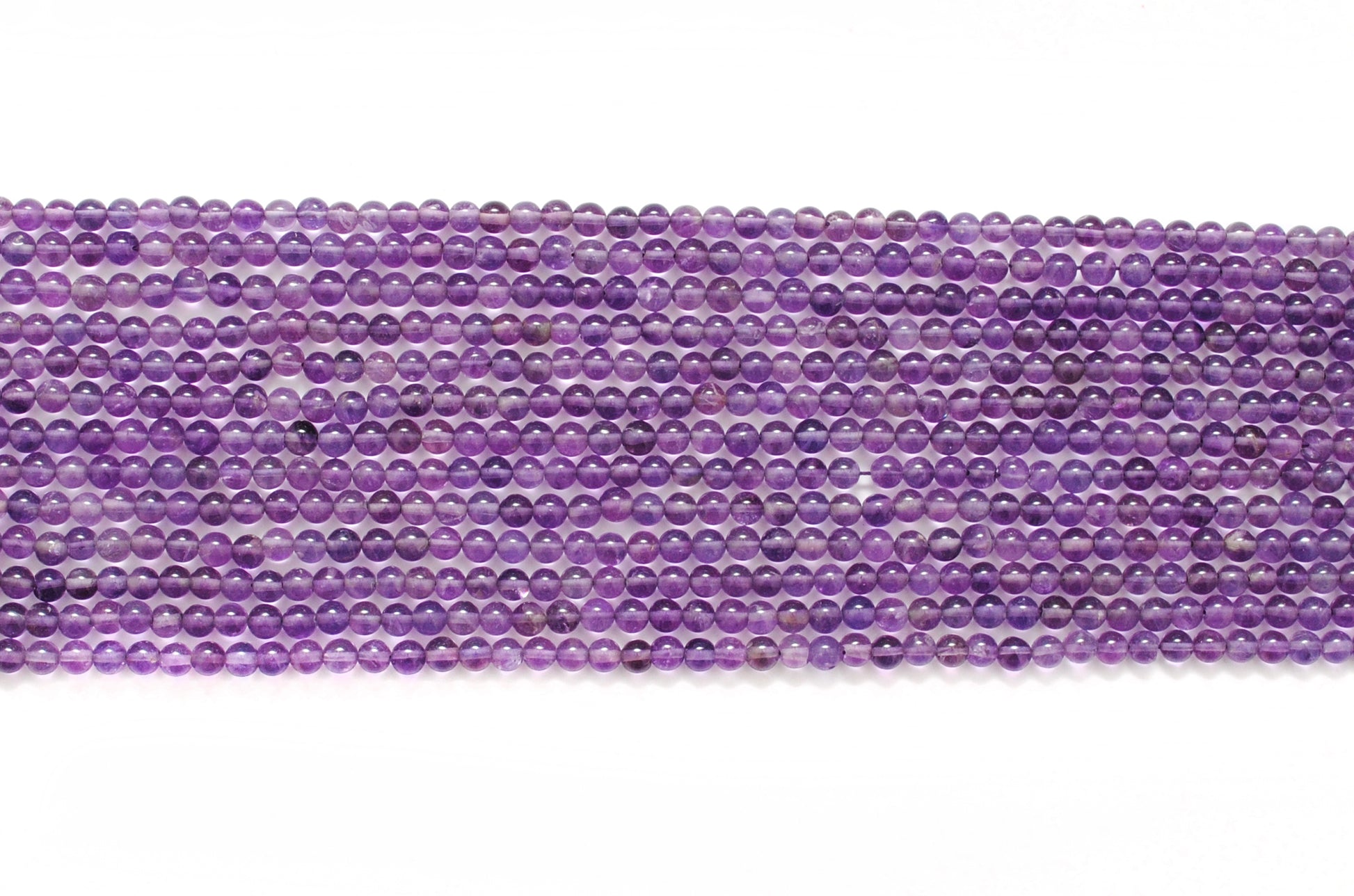 Natural amethyst 4mm smooth beads - scale reference