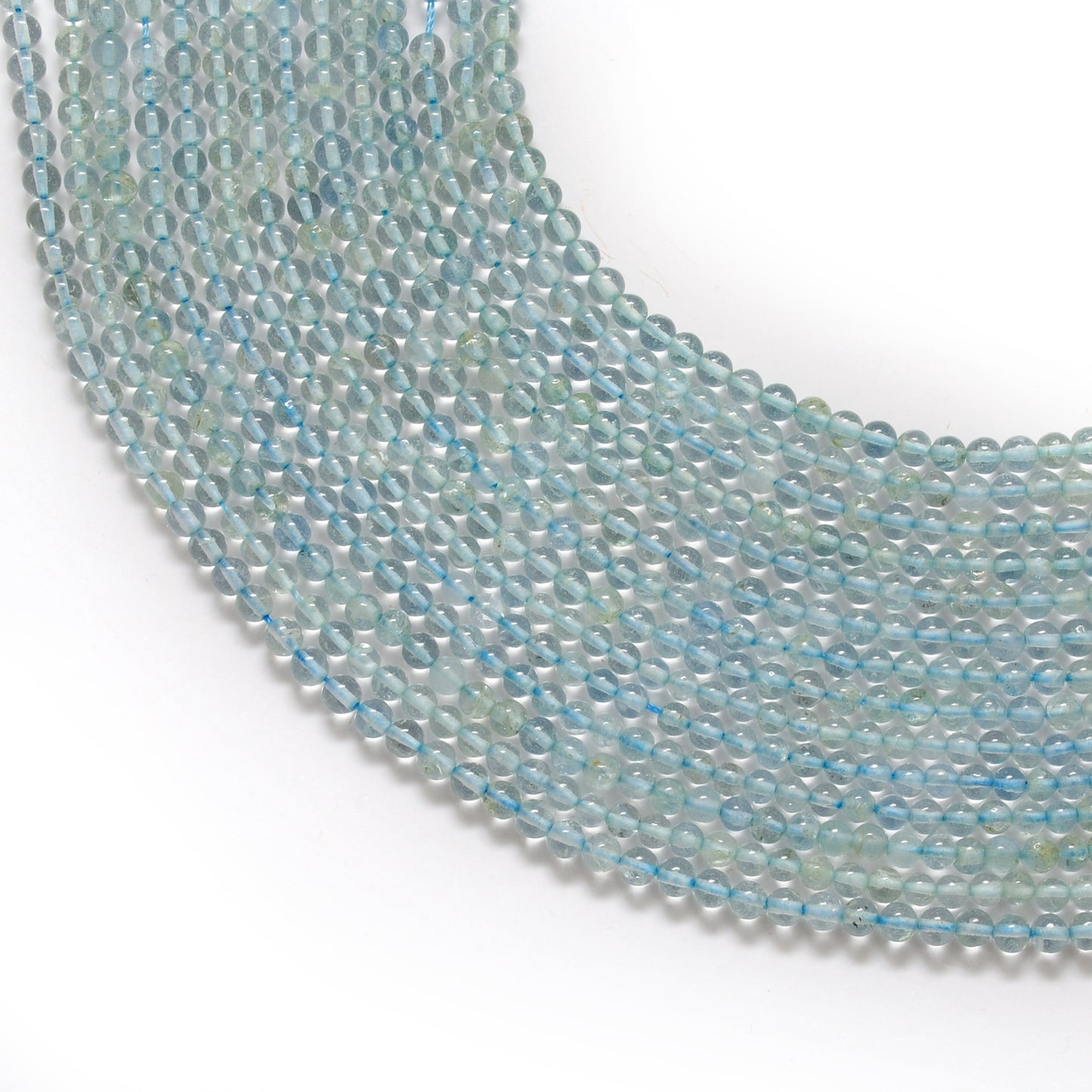Natural aquamarine round beads 3-3.5mm - front view strand pale blue