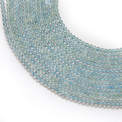 Natural aquamarine round beads 3-3.5mm - front view strand pale blue