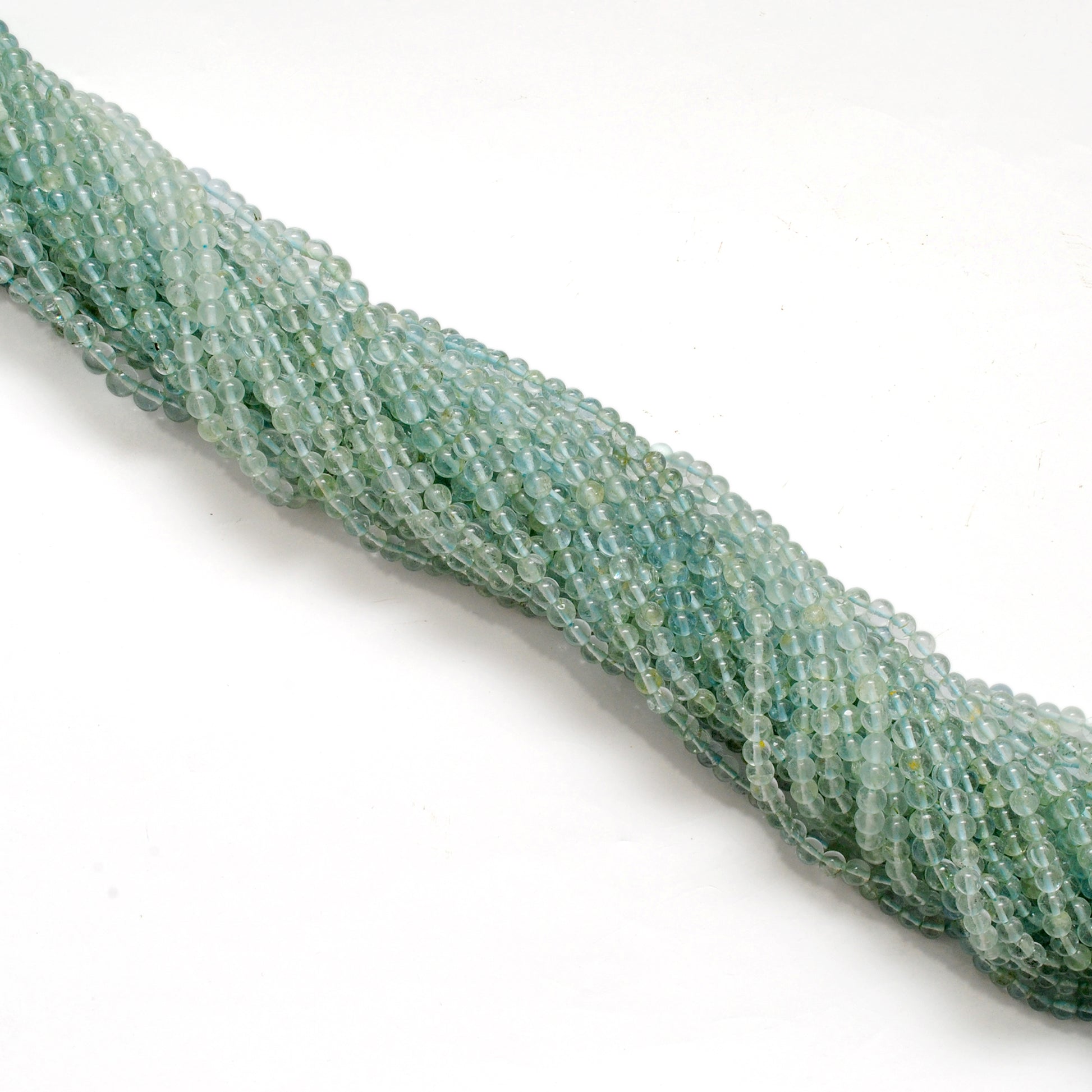 Natural aquamarine 4-5mm round beads 15 inch - overhead flat lay