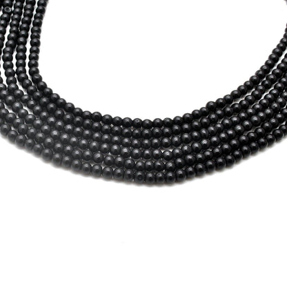 Natural black onyx round beads strand - overhead flat lay