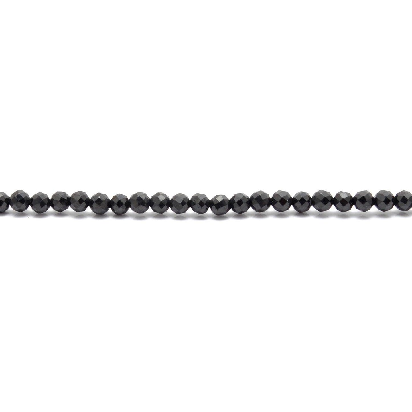 Natural black spinel beads scattered loose - premium quality