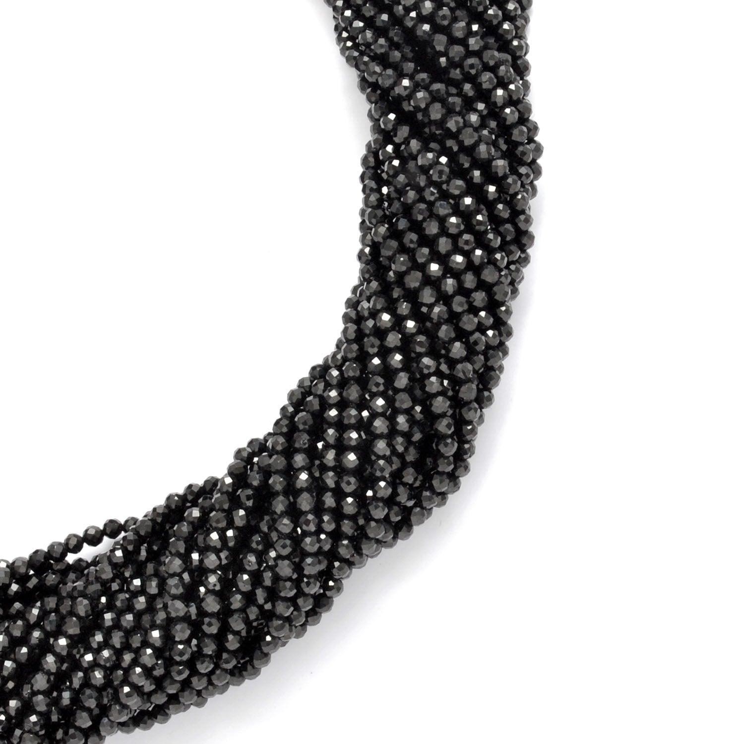 Natural black spinel round beads - overhead flat lay dark